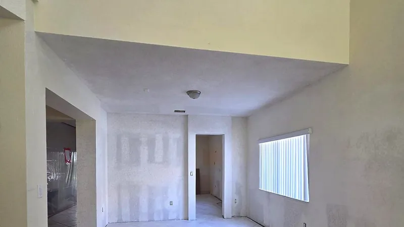 Room with patched drywall and joint compound before sanding, South Florida