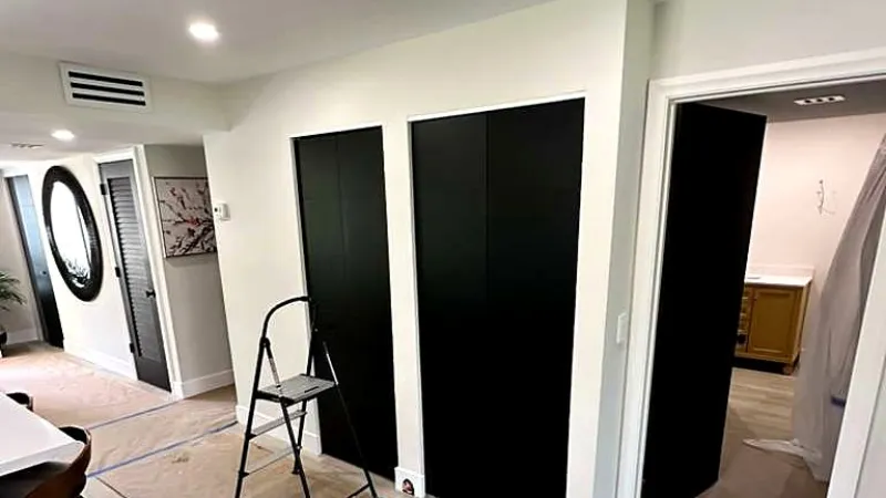 Freshly painted living room with clean trim lines, Miami interior painting project